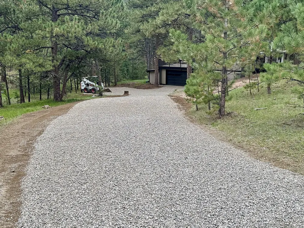 After: the same Evergreen, Colorado driveway regraded and resurfaced with three-quarter-inch gravel, seen from the top