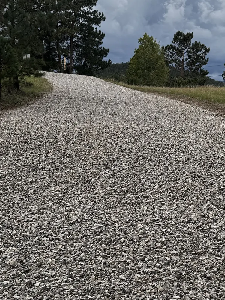 After: the same Evergreen, Colorado driveway from the bottom, regraded and topped with new three-quarter-inch gravel